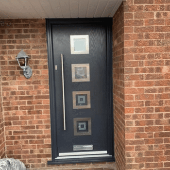 A black door with four squares on the front.