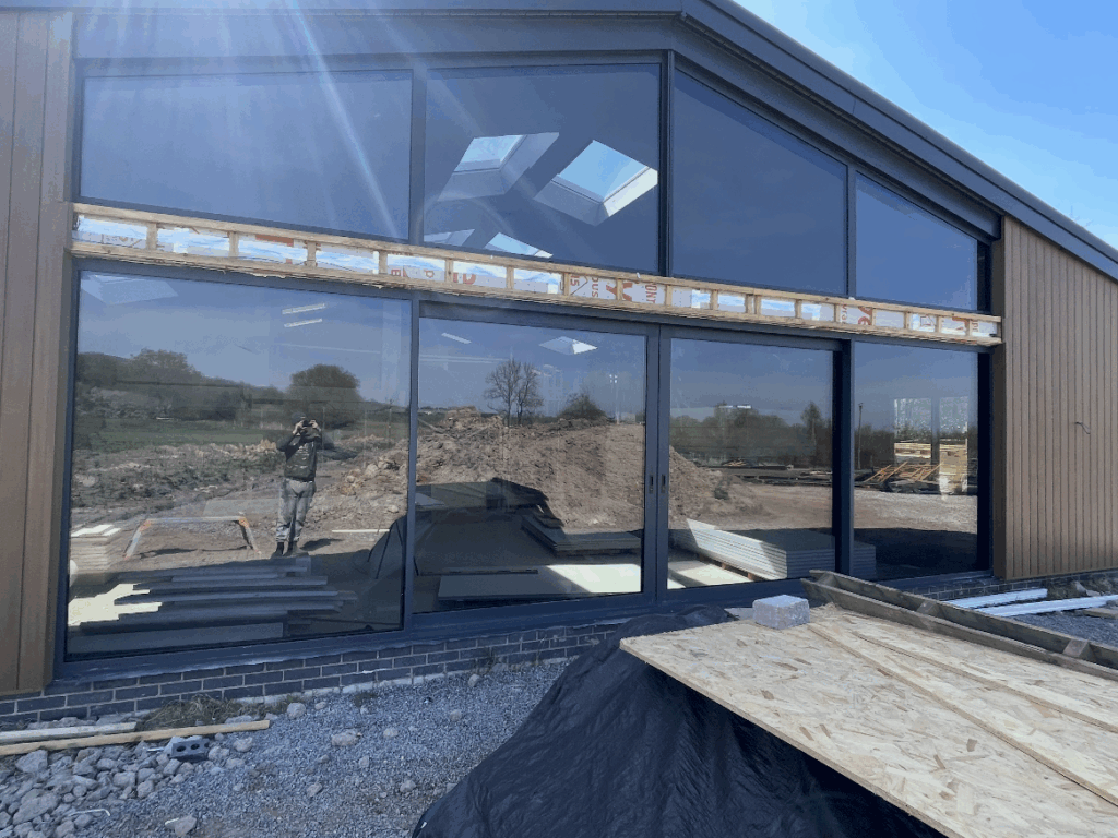 Large building with reflective glass windows.